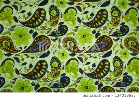 Green Silk Fabric Texture with Olive and Purple Tones Paisley Motif Green Silk Fabric Texture with Olive and Purple Tones Paisley Motif 134019653