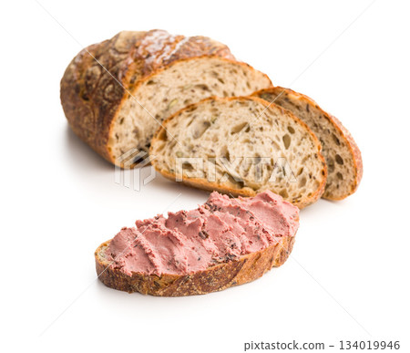 Pate on a slice of bread isolated on white background. Pate on a slice of bread isolated on white background. 134019946
