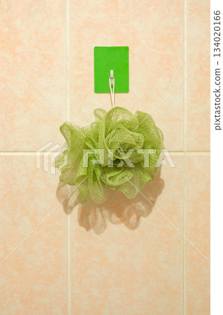 green washcloth hanging on hook in bathroom green washcloth hanging on hook in bathroom 134020166