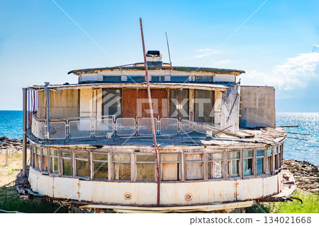 old ruined rusty passenger steamer on the seashore, end view old ruined rusty passenger steamer on the seashore, end view 134021668