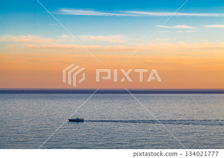 pleasure passenger boat sailing in sea at sunset 134021777