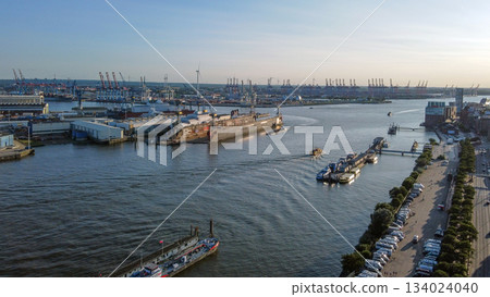 AErial view on NORDERELBE in Hamburg . In distance - shipyarfds with large cranes AErial view on NORDERELBE in Hamburg . In distance - shipyarfds with large cranes 134024040