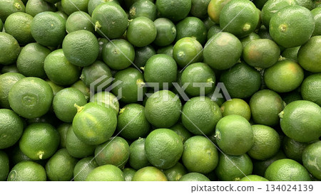 Top view of small limes display in a wet market with customizable space for text. Top view of small limes display in a wet market with customizable space for text. 134024139