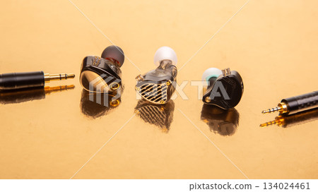Elegant trio of wired earbuds with braided cables Elegant trio of wired earbuds with braided cables 134024461
