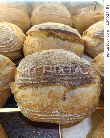 Crusty artisan bread loaf bakery rustic golden brown round boule fresh baked comfort Crusty artisan bread loaf bakery rustic golden brown round boule fresh baked comfort 134024498