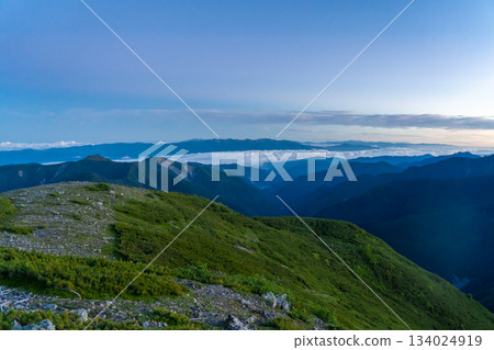 View of the Central Alps and sea of clouds at sunrise from Hyakkendaira Climbing Mount Akaishi in the Southern Alps 134024919