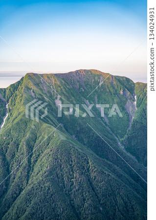 Mt. Hijiri (Mae Hijiri and Oku Hijiri) during the magic hour seen from Hyakkendaira. Climbing Mt. Akaishi in the Southern Alps. 134024931