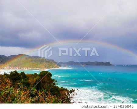 A rainbow over the ocean 134026045