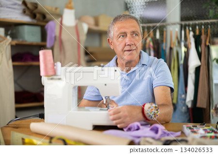 Mature male tailor resting 134026533