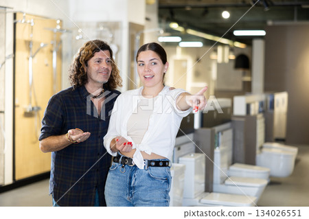 in plumbing department, couple thought about choosing suitable bathroom for new apartment 134026551