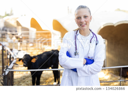Portrait of a young woman veterinarian on a farm 134026866