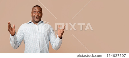 No way. Shocked african american mature man looking at camera in fully disbelief, orange background No way. Shocked african american mature man looking at camera in fully disbelief, orange background 134027507