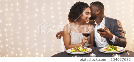 Romantic afro couple in beautiful outfit having dinner at restaurant, drinking red wine, eating healthy food Romantic afro couple in beautiful outfit having dinner at restaurant, drinking red wine, eating healthy food 134027682