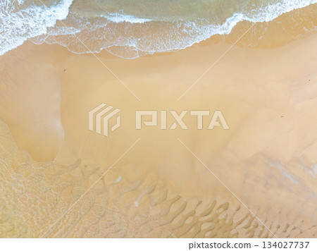 Aerial top view beach sea waves surface nature background 134027737