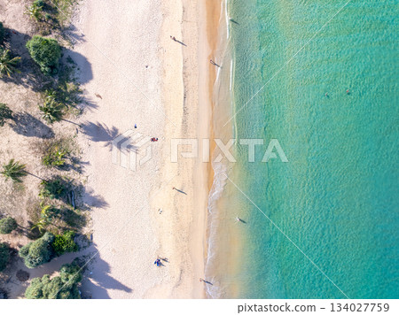 Aerial top view beach sea waves surface nature background Aerial top view beach sea waves surface nature background 134027759