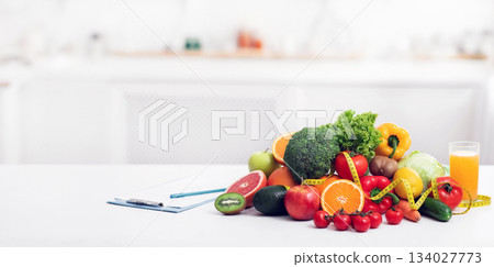 Nutritionist's empty workplace with fruits, vegetables, measuring tape and medical chart on table, panorama with copy space Nutritionist's empty workplace with fruits, vegetables, measuring tape and medical chart on table, panorama with copy space 134027773
