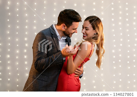 Beautiful loving happy afro couple dancing in modern restaurant. Celebrating St Valentine's Day 134027801