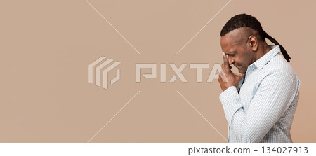 Lack of inspiration. Pensive mature african american man deep in thoughts, touching his forehead, side view, free space Lack of inspiration. Pensive mature african american man deep in thoughts, touching his forehead, side view, free space 134027913
