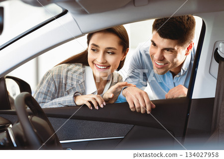 New Transport. Happy Husband And Wife Looking At New Auto Together, View From The Inside Of The Car. Copy Space 134027958
