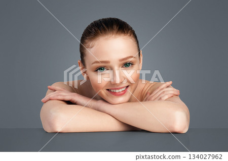 Red-Haired Young Woman With Perfect Smooth Skin Posing Shirtless Smiling To Camera Standing Over White Background In Studio. Beauty And Body Care For Youth, Skincare Cosmetics And Spa Concept Red-Haired Young Woman With Perfect Smooth Skin Posing Shirtless Smiling To Camera Standing Over White Background In Studio. Beauty And Body Care For Youth, Skincare Cosmetics And Spa Concept 134027962