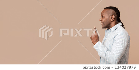 Mature african american man having idea, pointing finger up, got problem solution, profile portrait Mature african american man having idea, pointing finger up, got problem solution, profile portrait 134027979