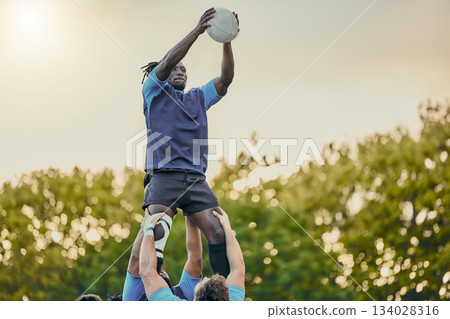 Sports, men and rugby and jump with team on field, playing game with energy and fitness, ball and action outdoor. Training, exercise and professional match, sport club with male group and active Sports, men and rugby and jump with team on field, playing game with energy and fitness, ball and action outdoor. Training, exercise and professional match, sport club with male group and active 134028316