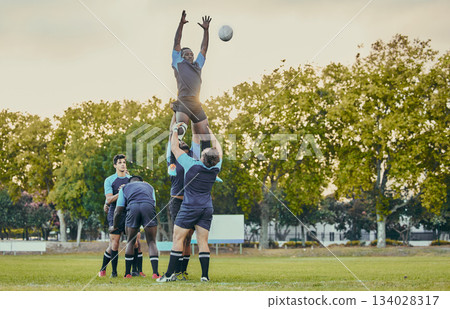Sport, men and rugby and jump with team on field, playing game with energy and fitness, ball and action outdoor. Training, exercise and professional match, sports club with male group and active Sport, men and rugby and jump with team on field, playing game with energy and fitness, ball and action outdoor. Training, exercise and professional match, sports club with male group and active 134028317