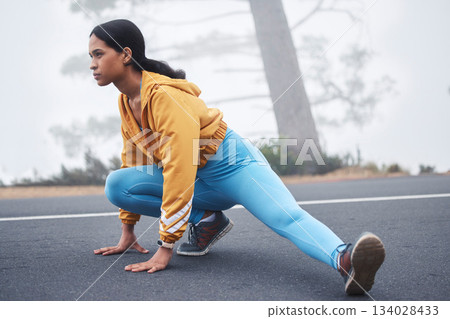 Outdoor fitness leg stretching, woman and runner exercise on a road in the mountains with focus. Workout warm up, running training and wellness of a young female ready for sports and marathon run 134028433