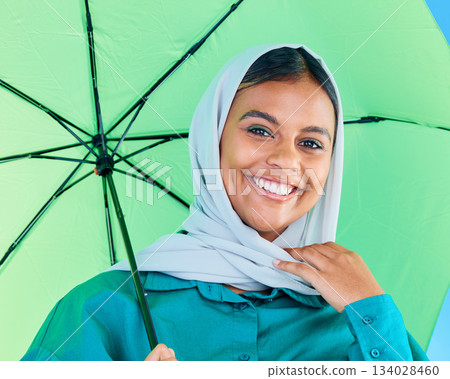 Fashion portrait, Muslim and happy woman with umbrella, designer brand clothes or casual outfit style. Trendy gen z winter aesthetic, beauty smile and face of Arabic Islamic female in studio Fashion portrait, Muslim and happy woman with umbrella, designer brand clothes or casual outfit style. Trendy gen z winter aesthetic, beauty smile and face of Arabic Islamic female in studio 134028460