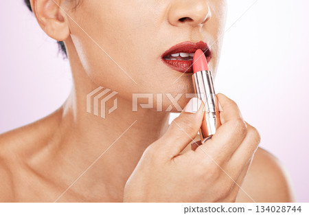 Lipstick application, woman and mouth on studio background for beauty, fashion and aesthetics. Closeup female model, red lips and makeup for glamour cosmetics, elegant skincare and color cosmetology 134028744
