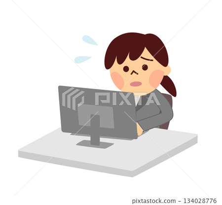 A woman in a suit working in a hurry on a computer 134028776