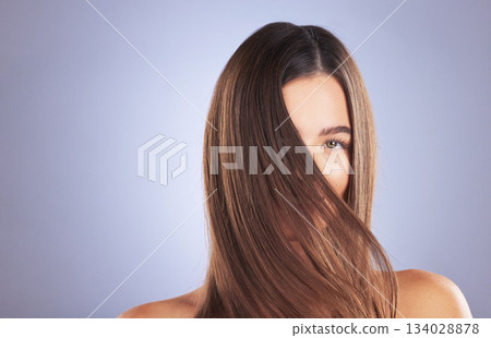Woman, beauty and hair portrait in studio for space, growth and healthy shine on blue background. Aesthetic female model for haircare texture, self care and cosmetic results for salon or hairdresser Woman, beauty and hair portrait in studio for space, growth and healthy shine on blue background. Aesthetic female model for haircare texture, self care and cosmetic results for salon or hairdresser 134028878