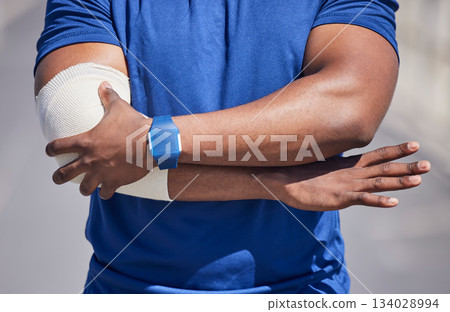 Black man, arm pain and injury, first aid bandage and health, medical emergency with muscle tension. Wound, inflammation and swollen joint, arthritis or fibromyalgia, painful elbow with injured male Black man, arm pain and injury, first aid bandage and health, medical emergency with muscle tension. Wound, inflammation and swollen joint, arthritis or fibromyalgia, painful elbow with injured male 134028994