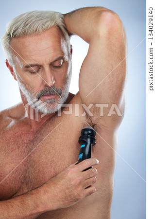 Skincare, deodorant and senior man for armpit, body hygiene and beauty products on blue background. Wellness, grooming mockup and elderly male with antiperspirant, fragrance and underarm in studio Skincare, deodorant and senior man for armpit, body hygiene and beauty products on blue background. Wellness, grooming mockup and elderly male with antiperspirant, fragrance and underarm in studio 134029140