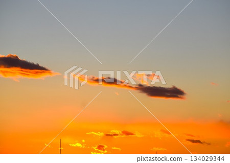 The beautifully colored sunset clouds change shape every moment 134029344