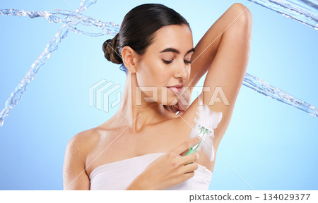 Beauty, water and woman with razor for shaving with foam, cleaning and cosmetics in blue background studio. Skincare, hair removal and girl with shaver product for body hygiene, grooming and wellness Beauty, water and woman with razor for shaving with foam, cleaning and cosmetics in blue background studio. Skincare, hair removal and girl with shaver product for body hygiene, grooming and wellness 134029377