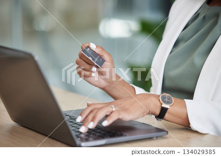 Woman hands, credit card and laptop for business online shopping, banking or fintech payment at her office. Professional person typing financial code information on computer for loan or transaction Woman hands, credit card and laptop for business online shopping, banking or fintech payment at her office. Professional person typing financial code information on computer for loan or transaction 134029385