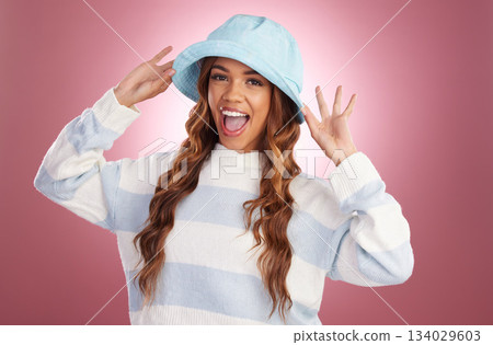 Happy, stylish and portrait of a woman with a hat isolated on a pink background in a studio. Excited, style and fashionable young girl with headwear for summer, cool clothing and an accessory 134029603