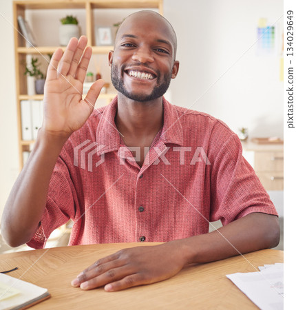 Wave, video call and portrait of black man in office for conference, communication and networking. Hello, greeting and online meeting with male in startup agency for virtual, friendly and webinar Wave, video call and portrait of black man in office for conference, communication and networking. Hello, greeting and online meeting with male in startup agency for virtual, friendly and webinar 134029649