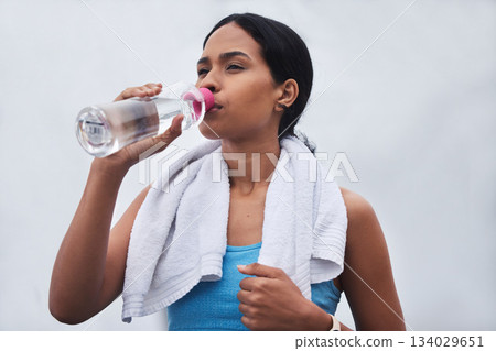 Running, rest and drinking water with woman in outdoors for fitness, training and cardio endurance. Stamina, health and workout with tired female runner for jogging, exercise and performance Running, rest and drinking water with woman in outdoors for fitness, training and cardio endurance. Stamina, health and workout with tired female runner for jogging, exercise and performance 134029651