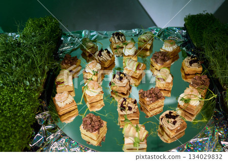 Elegant mushroom appetizer display, Serving tray featuring mushroom inspired treats, Artfully arranged decorative tray with creamy mushroom topped toasted bread slices Elegant mushroom appetizer display, Serving tray featuring mushroom inspired treats, Artfully arranged decorative tray with creamy mushroom topped toasted bread slices 134029832