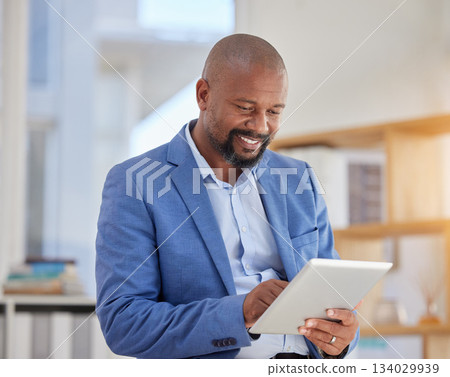 Smile, tablet and search with black man in office for digital, communication and email. Internet, technology and corporate with male employee in agency for planning, browsing online and networking 134029939