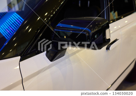 Detailed automotive reflection, Closeup of mirror and finish, Focus on car mirror with smooth surface, Close shot highlighting vehicle mirror and polished details Detailed automotive reflection, Closeup of mirror and finish, Focus on car mirror with smooth surface, Close shot highlighting vehicle mirror and polished details 134030020