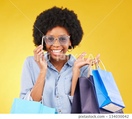 Shopping bag, happy phone call or portrait black woman with sales product, discount fashion deal or mall store present. Talking studio face, designer gift or female customer chat on yellow background Shopping bag, happy phone call or portrait black woman with sales product, discount fashion deal or mall store present. Talking studio face, designer gift or female customer chat on yellow background 134030042