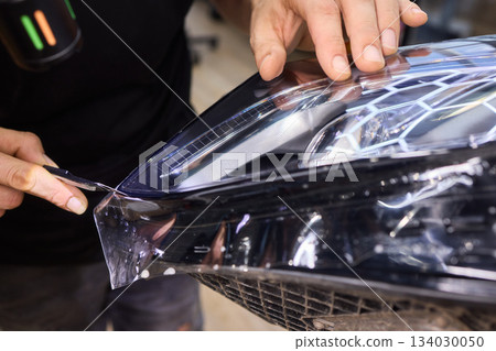 Applying a Protective Film on the Surface of Your Car for Enhanced Durability and Shine Applying a Protective Film on the Surface of Your Car for Enhanced Durability and Shine 134030050
