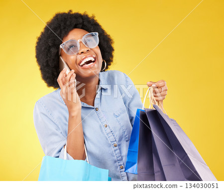 Shopping bag, phone call communication or black woman with sales product, discount fashion deal or mall store present. Talking, designer gift or chic happy customer chat isolated on yellow background 134030051