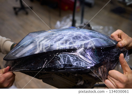 Applying a Protective Film on the Surface of Your Car for Enhanced Durability and Shine Applying a Protective Film on the Surface of Your Car for Enhanced Durability and Shine 134030061