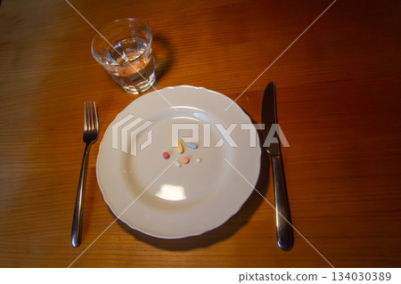 Taking medicines for breakfast Taking medicines for breakfast 134030389