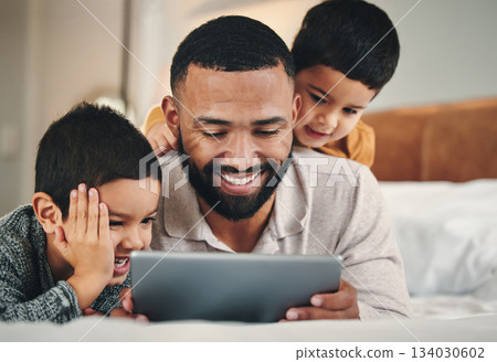 Dad, boy kids and bed with tablet for bonding, love and streaming movie on web app with happiness. Man, children and bedroom in family home with touchscreen for game, e learning and relax together 134030602