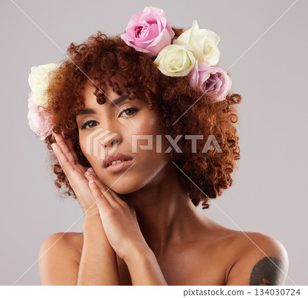 Portrait, skincare and flowers with a model woman in studio on a gray background for natural beauty. Wellness, luxury and face with an attractive young female wearing a flower crown or wreath 134030724